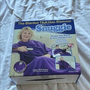 Snuggie wearable fleece blanket with sleeves in passion purple.